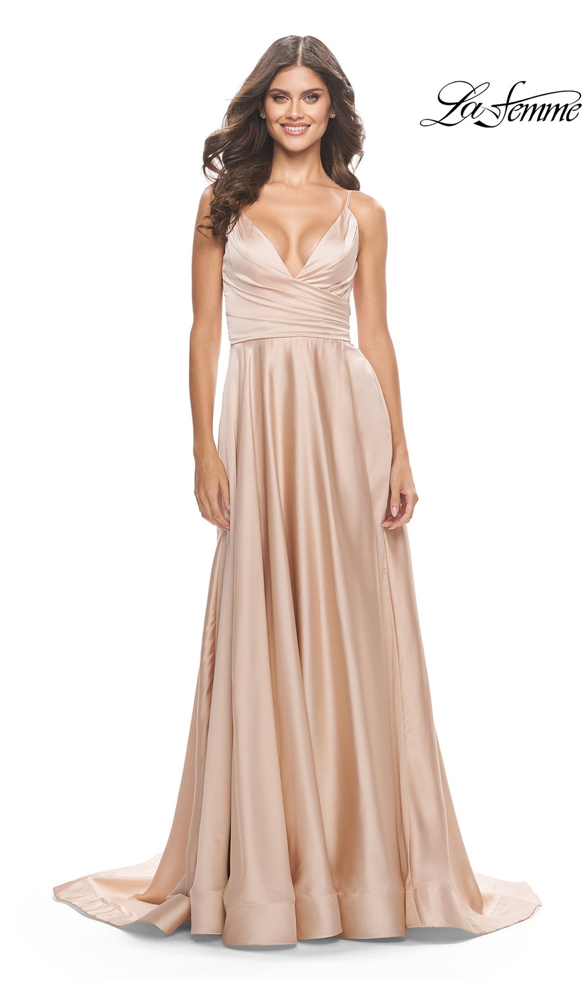 A woman wearing La Femme V-Neck Long A-Line Prom Dress 31505, a sleeveless, floor-length champagne satin gown with a deep V-neckline.